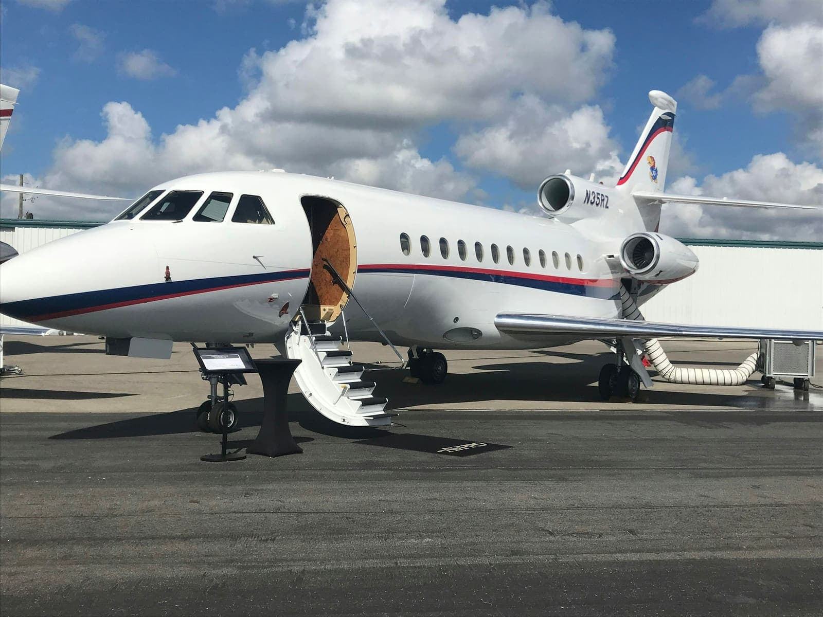 Airstairs lowered from a Dassault Falcon on the ramp